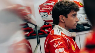 Leclerc surrounded by fans as he tries to get away